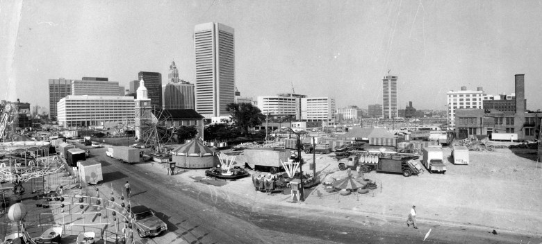 A black and white photograph of the Baltimore City Fair.  September 15, 1976-BALTIMORE CITY FAIR--From high on one of the rides this photo shows the full 27 acre site of the City Fair that opens at noon Friday. That's Otterbein Church on Sharp street at left center.  Photo by Sun photographer Irving Phillips.  AHF-429-BS