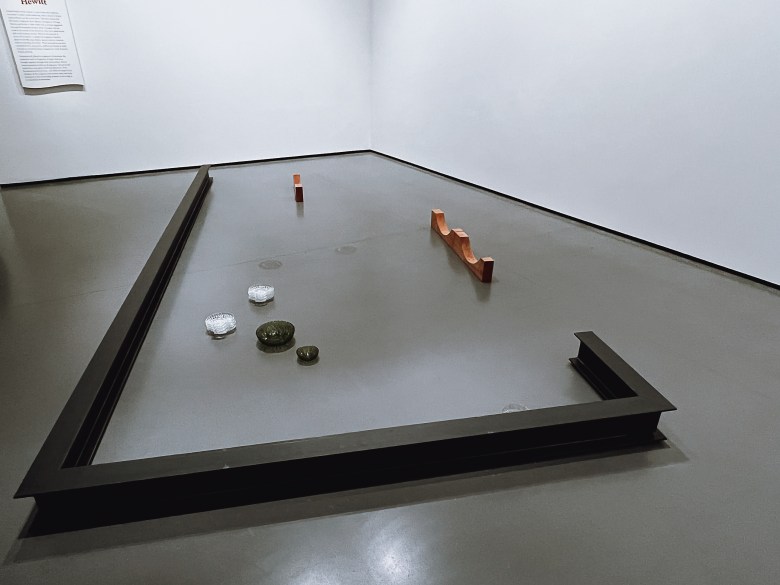 A photograph of an installation at the Baltimore Museum of Art, it is a large conceptual artwork on the floor. 