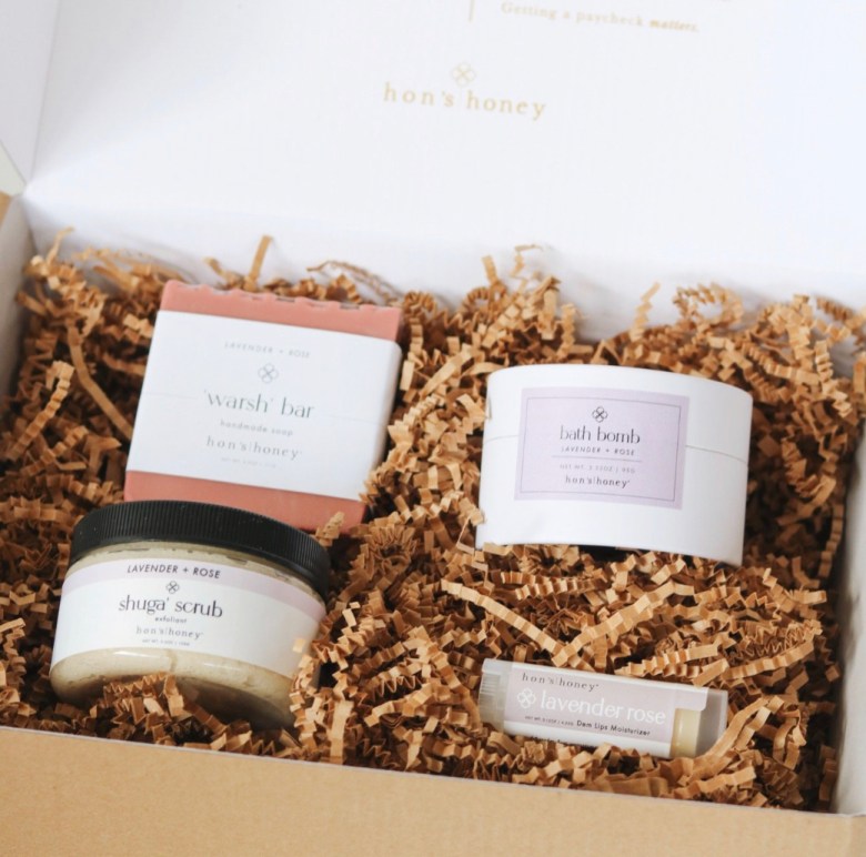 A photograph of a box of lavender bath items. 
