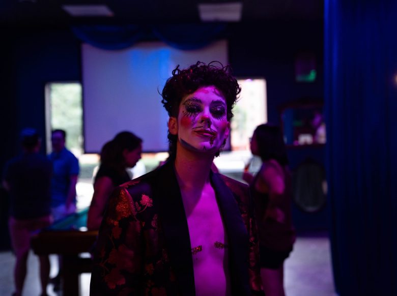 A Drag king perfomer poses as they wait for their stage time at "Boy Next Door Event" at Car Bar.
