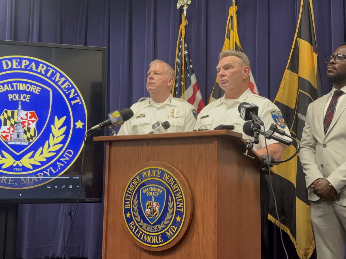 A photo of a group of men at a Baltimore Police Department press conference.