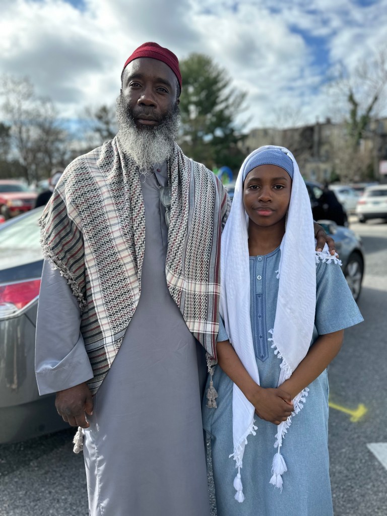A man and child pose for a photo.