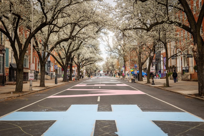 The words #wewontbeerased painted on the street.
